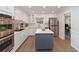 Well-lit kitchen with white cabinets, subway tile backsplash, and stainless steel appliances at 935 Old Loganville Rd, Loganville, GA 30052