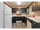 Kitchen with ample countertop space, appliances and black cabinetry at 935 Old Loganville Rd, Loganville, GA 30052