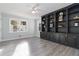 Spacious living room with custom built-in shelves and ample natural light at 935 Old Loganville Rd, Loganville, GA 30052