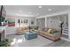 Spacious living room featuring neutral tones and a comfortable sectional sofa at 935 Old Loganville Rd, Loganville, GA 30052