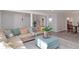 Open concept living area with access to dining room and stairs to upper level at 935 Old Loganville Rd, Loganville, GA 30052
