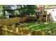 Fenced backyard with grass and mature trees offers a private outdoor space at 1425 Parkmont Dr, Roswell, GA 30076