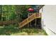 Spacious backyard with deck, stairs, and a newly-installed fence at 1425 Parkmont Dr, Roswell, GA 30076