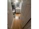 This bathroom features white fixtures, hardwood floors and an overhead light fixture at 1425 Parkmont Dr, Roswell, GA 30076