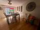 Cozy dining room with hardwood floors, natural light and modern chandelier at 1425 Parkmont Dr, Roswell, GA 30076