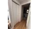 Hallway includes a closet and entryway to a bathroom on hardwood flooring at 1425 Parkmont Dr, Roswell, GA 30076