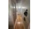 Hallway with hardwood flooring, storage, and access to other rooms at 1425 Parkmont Dr, Roswell, GA 30076