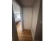 Hallway leading to a bedroom, featuring hardwood floors and neutral wall paint at 1425 Parkmont Dr, Roswell, GA 30076