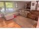 A spacious living room with a plush sectional couch, lots of light and hardwood floors at 1425 Parkmont Dr, Roswell, GA 30076
