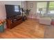 Bright living room featuring hardwood floors, a comfortable sectional, and modern decor at 1425 Parkmont Dr, Roswell, GA 30076