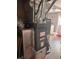 Utility area with Goodman furnace and water heater on a hard surface floor at 1425 Parkmont Dr, Roswell, GA 30076