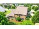 A beautiful aerial view of the house with large backyard, green trees, and a screened in porch at 1771 Silvergrass Ln, Grayson, GA 30017