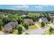 An elevated street view showcases several suburban homes among lush trees at 1771 Silvergrass Ln, Grayson, GA 30017