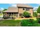 Lush backyard with screened-in porch, well-maintained lawn and tasteful landscaping at 1771 Silvergrass Ln, Grayson, GA 30017