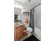 Functional bathroom featuring a tub and shower combination and a wooden vanity at 1771 Silvergrass Ln, Grayson, GA 30017