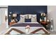 Cozy bedroom with a blue accent wall, featuring stylish decor and comfortable furnishings at 1771 Silvergrass Ln, Grayson, GA 30017