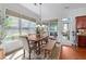 Bright dining room features a large window, wood flooring, and neutral decor at 1771 Silvergrass Ln, Grayson, GA 30017