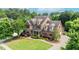 An appealing two-story home featuring well-maintained landscaping and charming architectural details at 1771 Silvergrass Ln, Grayson, GA 30017