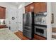 Modern kitchen boasts stainless steel appliances, granite counters, and ample cabinet space at 1771 Silvergrass Ln, Grayson, GA 30017
