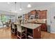 Bright kitchen featuring granite countertops, stainless appliances, and wooden cabinets at 1771 Silvergrass Ln, Grayson, GA 30017