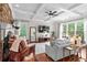 Bright living room with fireplace, coffered ceilings, hardwood floors, and large windows at 1771 Silvergrass Ln, Grayson, GA 30017
