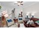 Inviting living room features hardwood floors, neutral paint, staircase, and bright natural light at 1771 Silvergrass Ln, Grayson, GA 30017