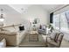 Inviting living room with vaulted ceiling, neutral decor, and an abundance of natural light at 1771 Silvergrass Ln, Grayson, GA 30017