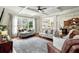 Spacious living room features coffered ceilings, large windows, hardwood floors, and neutral tones at 1771 Silvergrass Ln, Grayson, GA 30017