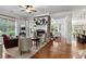 Inviting living room featuring hardwood floors, a fireplace, and large windows offering natural light at 1771 Silvergrass Ln, Grayson, GA 30017
