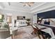 Bright main bedroom featuring seating area and stylish furnishings, providing a relaxing retreat at 1771 Silvergrass Ln, Grayson, GA 30017