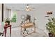 Bright office space featuring a ceiling fan and a large window with stylish decorations at 1771 Silvergrass Ln, Grayson, GA 30017