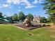 Community playground with slides and climbing structures situated on a grassy lawn, fostering active play at 1771 Silvergrass Ln, Grayson, GA 30017