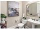 Stylish powder room with modern fixtures, art, and elegant decor for a luxurious feel at 1771 Silvergrass Ln, Grayson, GA 30017