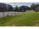 Well-kept tennis courts surrounded by lush greenery, offering a great recreational amenity at 1771 Silvergrass Ln, Grayson, GA 30017