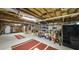 Unfinished basement with exposed ceilings, storage racks, and open space at 180 Mountain Path, Rockmart, GA 30153