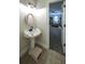 Bathroom boasts a tile floor and a white sink with a pink-framed mirror and a step stool at 180 Mountain Path, Rockmart, GA 30153