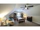 Bedroom features carpet, ceiling fan, a window, desk, bookshelves, and dresser at 180 Mountain Path, Rockmart, GA 30153