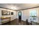 Inviting entryway featuring hardwood floors, decorative mirror, and stylish front door at 180 Mountain Path, Rockmart, GA 30153