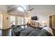 Open living room featuring vaulted ceilings, hardwood floors, and expansive windows at 180 Mountain Path, Rockmart, GA 30153