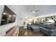 Open-concept living area with hardwood floors, vaulted ceiling, and connection to the kitchen at 180 Mountain Path, Rockmart, GA 30153