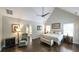 Cozy bedroom with hardwood floors, accent chair, ensuite, and an abundance of natural light at 180 Mountain Path, Rockmart, GA 30153