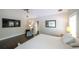 Relaxing main bedroom featuring hardwood floors, chair, and a door to the ensuite bathroom at 180 Mountain Path, Rockmart, GA 30153