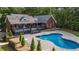 Backyard showcasing a pool, patio, and lush landscaping at 180 Mountain Path, Rockmart, GA 30153