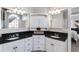 Elegant bathroom with double vanity, granite counters and cabinet storage at 2006 Hubbard Ct, Villa Rica, GA 30180