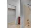 Bathroom showcasing a shower, bathtub, and a walk-in closet with a wooden closet rod at 235 Trailmore Ct, Roswell, GA 30076