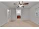 Bright bedroom featuring a ceiling fan, neutral carpet, and ample natural light at 235 Trailmore Ct, Roswell, GA 30076