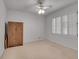 Bedroom with natural light, neutral carpet, and plantation shutters for a cozy feel at 235 Trailmore Ct, Roswell, GA 30076