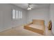 Bedroom featuring a window with shutters, carpet, and a ceiling fan for comfort at 235 Trailmore Ct, Roswell, GA 30076