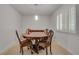 Dining room with a round table, seating for four, and a window at 235 Trailmore Ct, Roswell, GA 30076