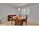 Well-lit dining room featuring classic furnishings and natural light at 235 Trailmore Ct, Roswell, GA 30076